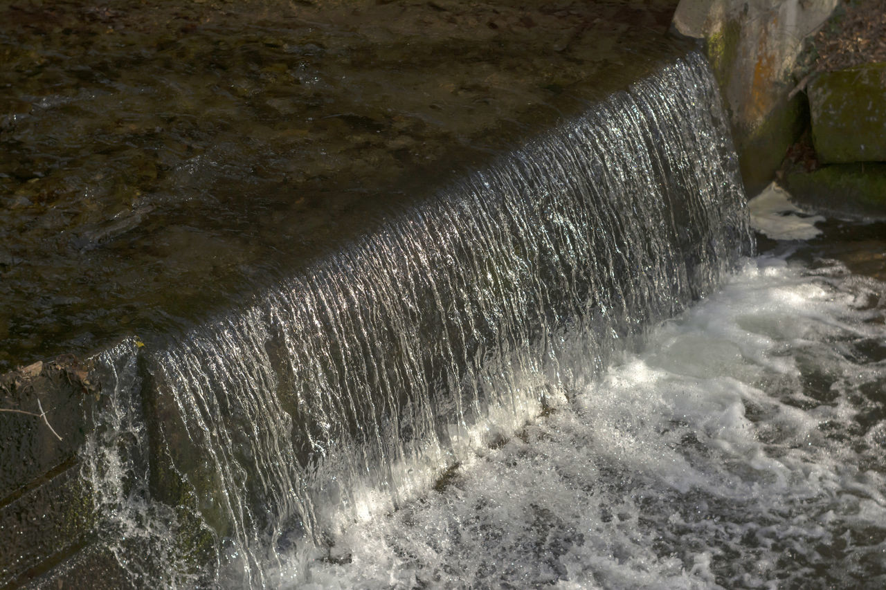 SEA WAVES SPLASHING ON ROCK