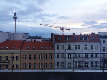 Low angle view of building against cloudy sky