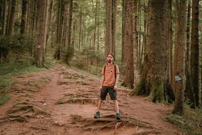 Man standing in forest