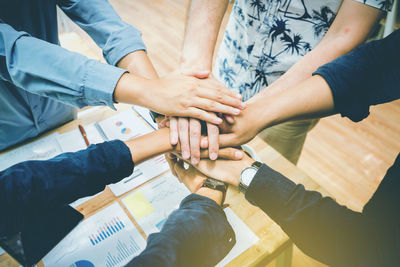 High angle view of people hands