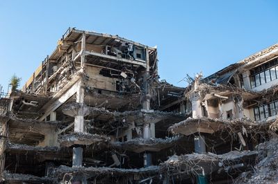 Low angle view of abandoned building against clear sky