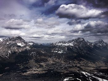 Scenic view of storm clouds over mountains