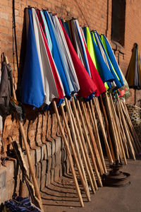 Clothes drying on wooden chairs