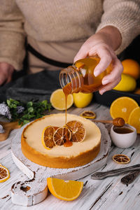 Midsection of man preparing food on table