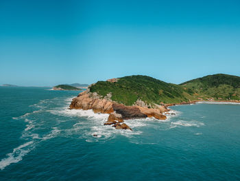 Scenic view of sea against clear blue sky