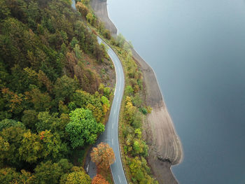 High angle view of road amidst trees and mountains