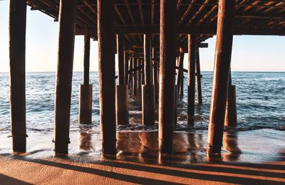 Pier over sea against sky