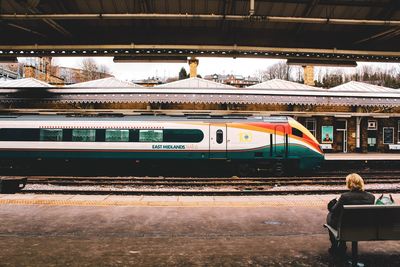 Train at railroad station platform during winter