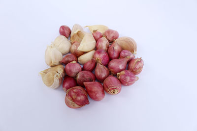 Close-up of berries against white background