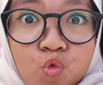 Close-up portrait of girl wearing eyeglasses