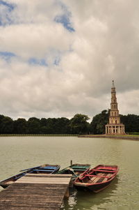 Boats in river with buildings in background