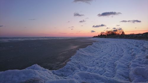 Scenic view of sea against sky during winter