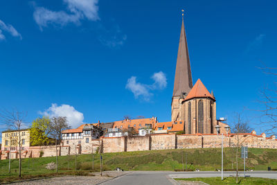 Low angle view of building against blue sky