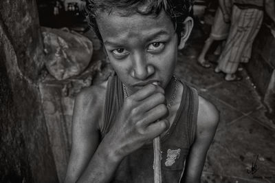 Portrait of young man sitting outdoors