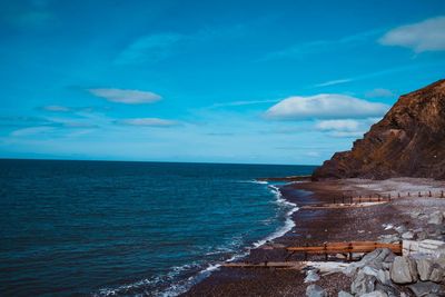 Scenic view of sea against blue sky