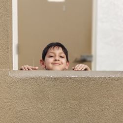Portrait of cute boy at home