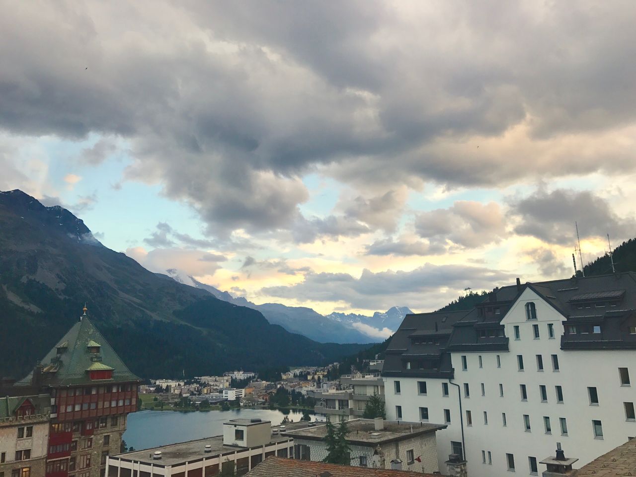 mountain, building exterior, architecture, built structure, sky, house, cloud - sky, residential building, outdoors, no people, mountain range, nature, day, town, beauty in nature, scenery, city