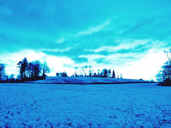 Scenic view of frozen lake against sky