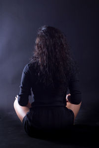 Close-up of a man sitting outdoors