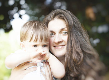 Portrait of mother with son outdoors