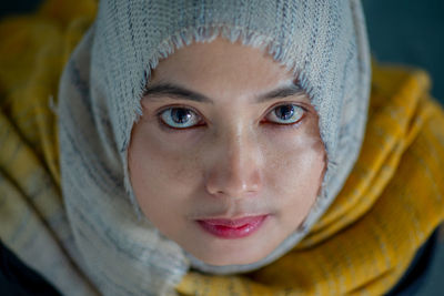 Close-up portrait of young woman wearing hijab