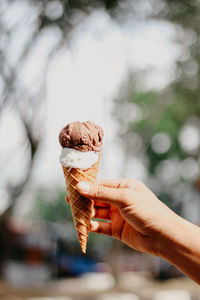 Hand holding ice cream cone