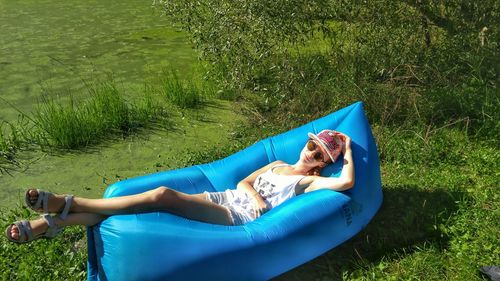 Woman lying on field