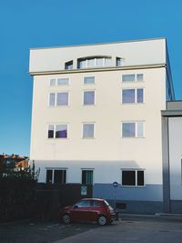 Building by street against clear sky