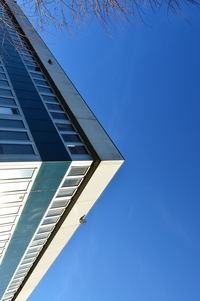 Low angle view of built structure against clear blue sky