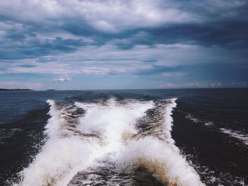 Scenic view of sea against cloudy sky