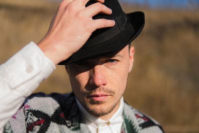 Caucassian man in a hat posing rural area of ukraine