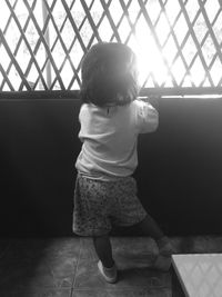 Rear view of man looking at home