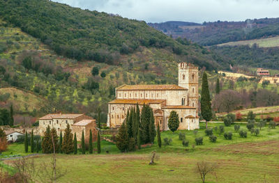 Built structure on landscape with mountain in background