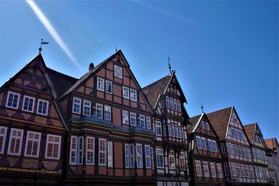 Low angle view of old building against blue sky