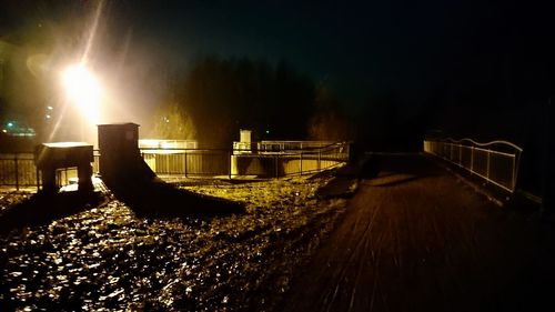 Illuminated trees against sky at night