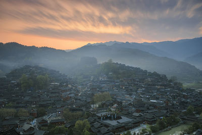 High angle view of townscape against sky during sunset