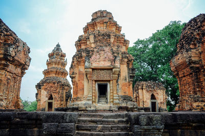 Low angle view of old ruins against sky