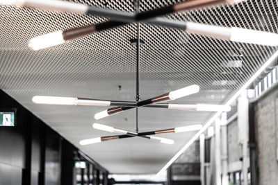 Low angle view of illuminated lights in building