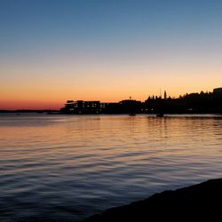 Scenic view of sea against orange sky