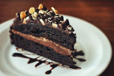 Slice of cake served on table