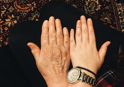 Close-up of hands against blurred background