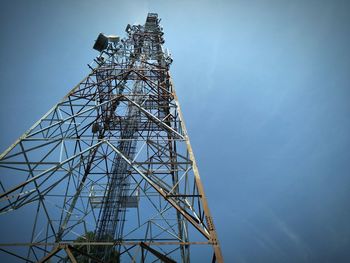 Low angle view of communications tower against sky