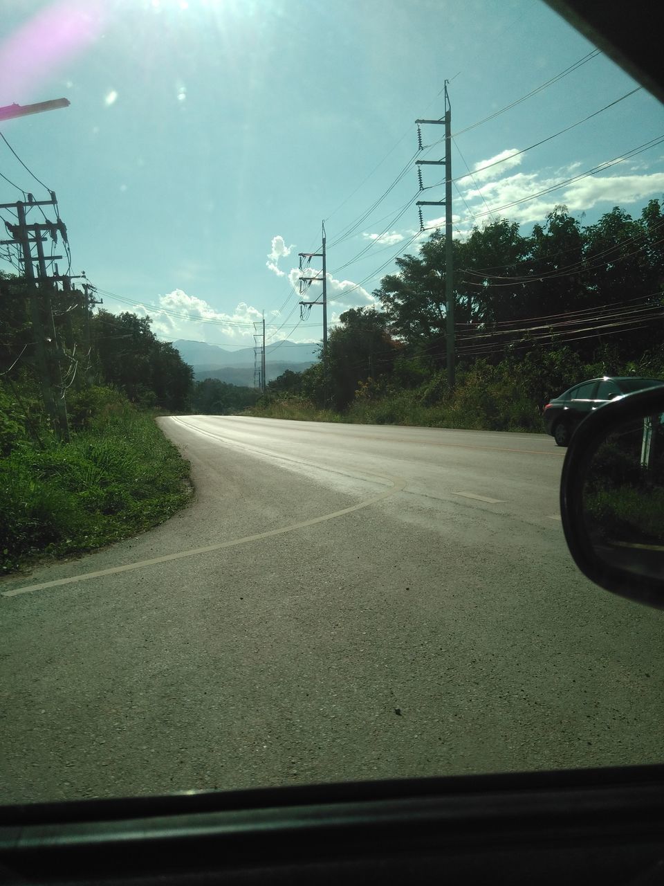 VIEW OF CAR ON ROAD