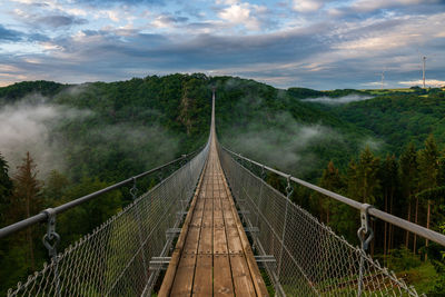 View of footbridge against sky