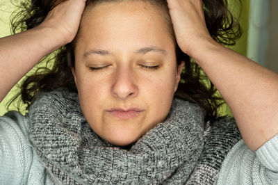 Close-up portrait of man relaxing on bed