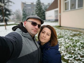 Portrait of couple standing during winter