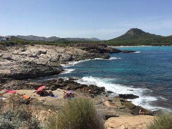 Scenic view of sea against clear blue sky