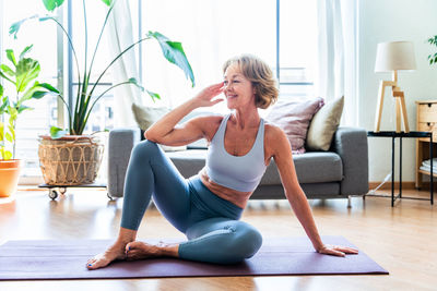 Young woman exercising in gym