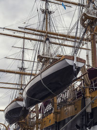 Boats moored at harbor