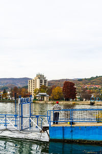 View of swimming pool in river against buildings